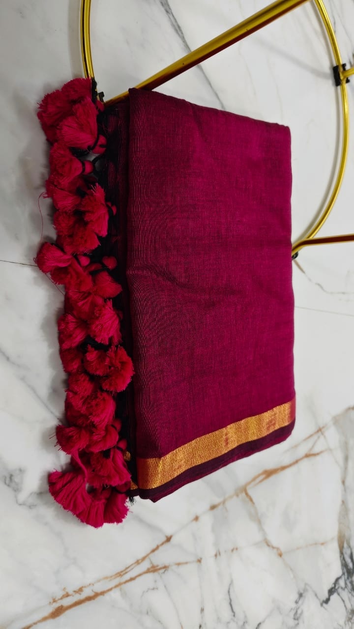 Magenta Handloom Saree with Golden Border & Tassel Detailing